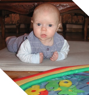 Tummy time: baby playing on stomach