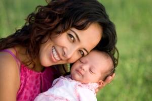 Newborn baby and happy mother