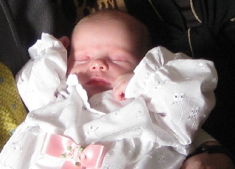 Christening baby at three weeks old