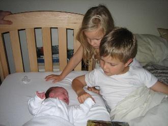 Newborn sleeping in cosleeper