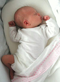 Newborn baby sleeping on back