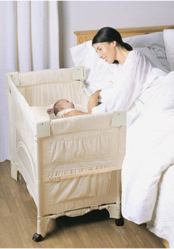 baby crib attached to bed