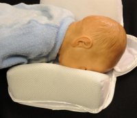 how to keep newborn from rolling over in bassinet