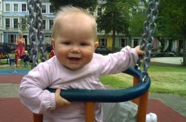 8 month old baby playing and smiling