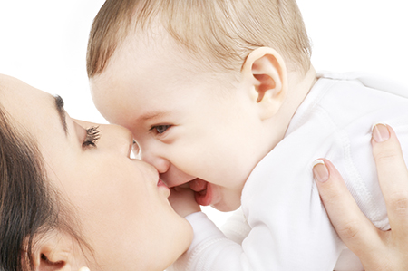 mom holding baby up