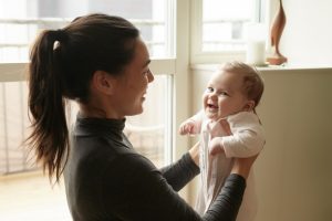 Mom holding baby upright