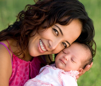 Newborn with smiling mom