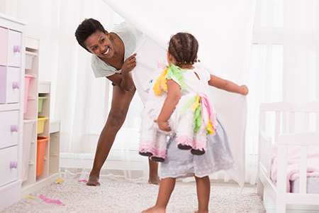 Mom and toddler girl playing