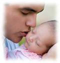 Daddy and baby kiss
