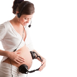 Pregnant woman talking bonding with baby