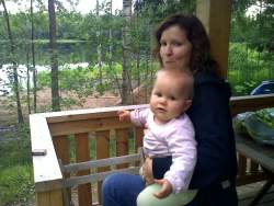 Ten months old baby at summer cabin lake Finland