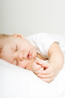 Beautiful baby sleeping folding hands